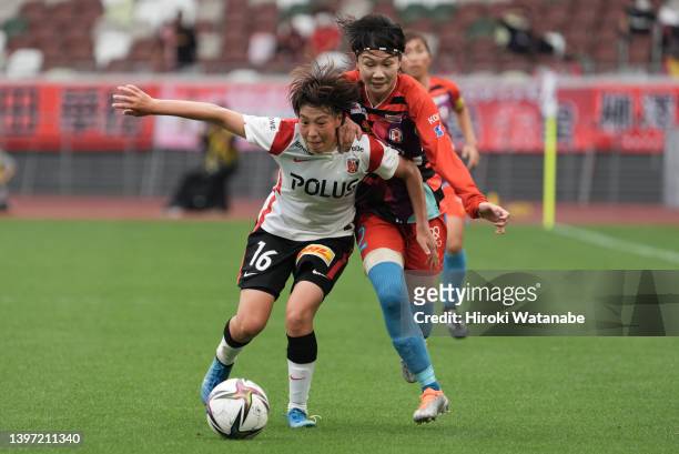 Yuki Mizutani of Urawa Red Diamonds Ladies and MIyabi Moriya of INAC Kobe Leonessa compete for the ball during the WE League match between INAC Kobe...