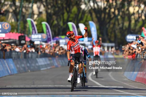 Thomas De Gendt of Belgium and Team Lotto Soudal celebrates winning ahead of Davide Gabburo of Italy and Team Bardiani CSF Faizane' and Jorge Arcas...