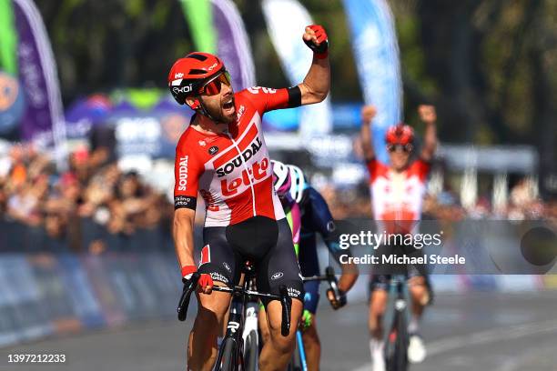 Thomas De Gendt of Belgium and Team Lotto Soudal celebrates winning ahead of Davide Gabburo of Italy and Team Bardiani CSF Faizane' and Jorge Arcas...