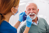 Doctor checking up patient at dentist office