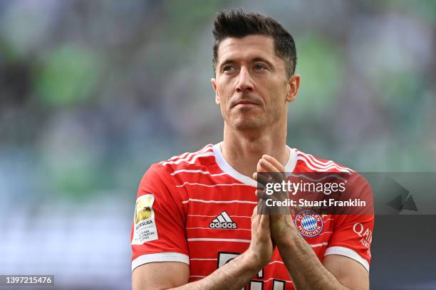 Robert Lewandowski of FC Bayern Muenchen celebrates after their side finished the season as Bundesliga champions during the Bundesliga match between...