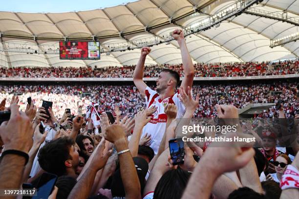 Sasa Kalajdzic of VfB Stuttgart celebrates with the fans as they avoid the relegation play offs after their sides victory during the Bundesliga match...