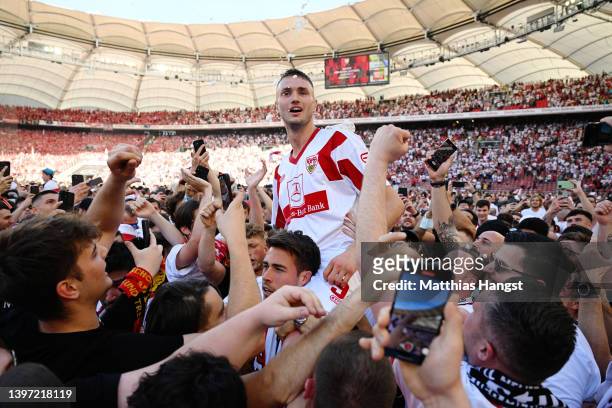 Sasa Kalajdzic of VfB Stuttgart celebrates with the fans as they avoid the relegation play offs after their sides victory during the Bundesliga match...