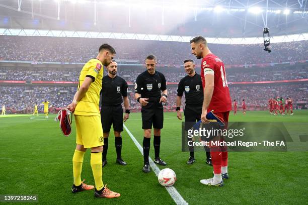 Referee, Craig Pawson does the coin toss with captains Jorginho of Chelsea and Jordan Henderson of Liverpool prior to The FA Cup Final match between...