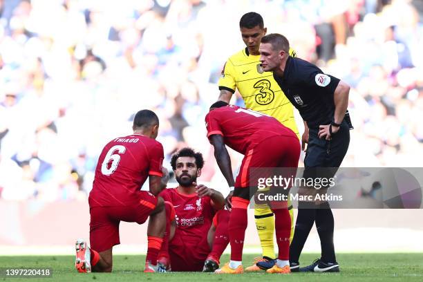 Mohamed Salah of Liverpool goes down injured during The FA Cup Final match between Chelsea and Liverpool at Wembley Stadium on May 14, 2022 in...