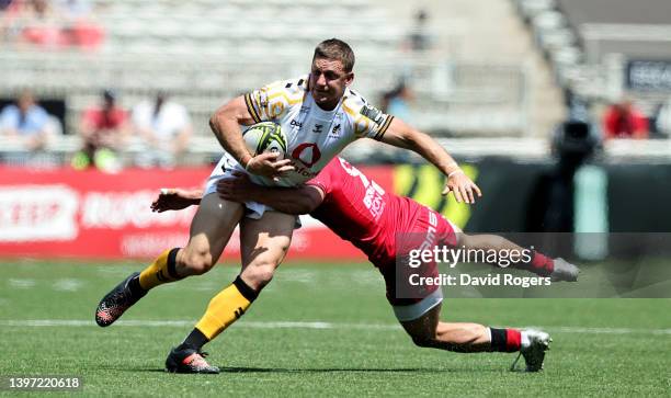 Jimmy Gopperth of Wasps is tackled by Baptiste Couilloud during the EPCR Challenge Cup Semi Final match between Lyon and Wasps at Matmut Stadium on...