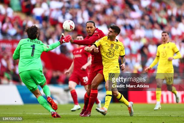 Alisson of Liverpool makes a save whilst Virgil van Dijk of Liverpool battles for possession with Christian Pulisic of Chelsea during The FA Cup...