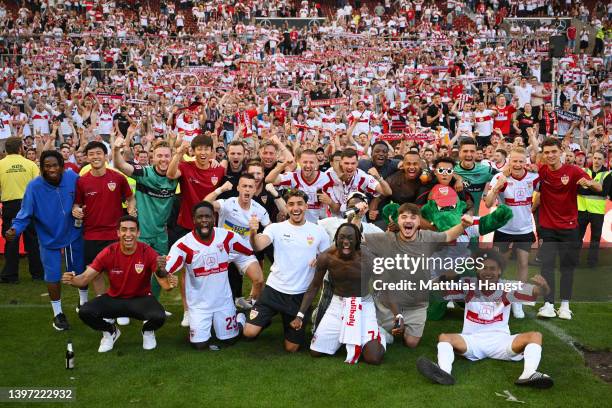 VfB Stuttgart players celebrate with the fans on the pitch after their sides victory which results in VfB Stuttgart avoiding the relegation play offs...