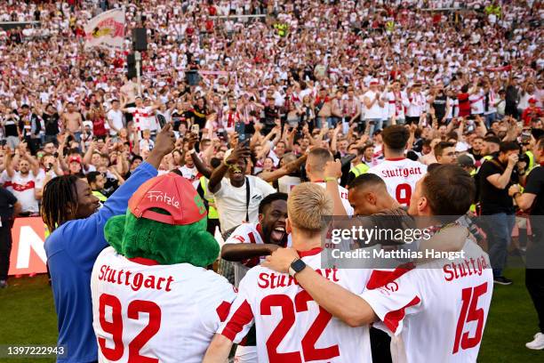 VfB Stuttgart players celebrate with the fans on the pitch after their sides victory which results in VfB Stuttgart avoiding the relegation play offs...