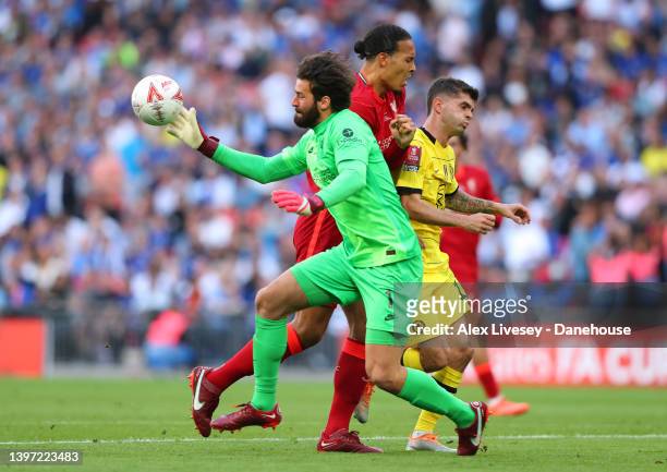 Alisson Becker and Virgil Van Dijk of Liverpool hold off a challenge from Christian Pulisic of Chelsea during The FA Cup Final match between Chelsea...
