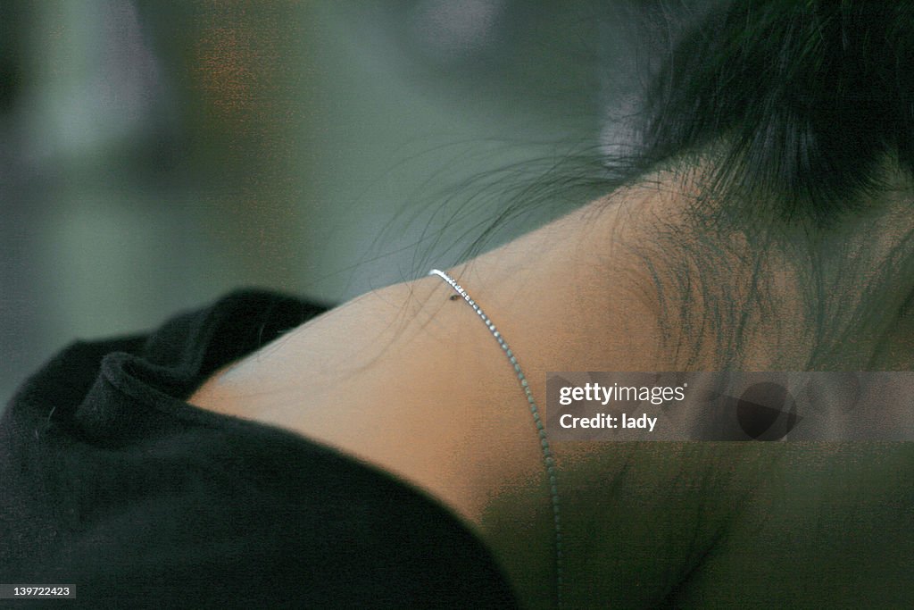 View of girl neck wearing chain