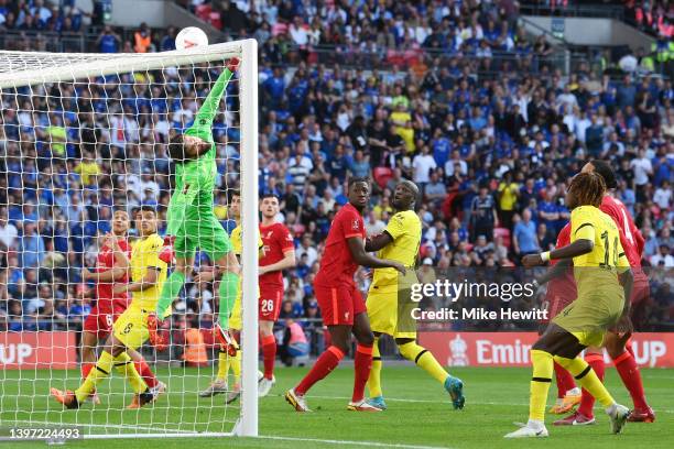 Alisson Becker of Liverpool watches the ball onto the bar from a free kick during The FA Cup Final match between Chelsea and Liverpool at Wembley...