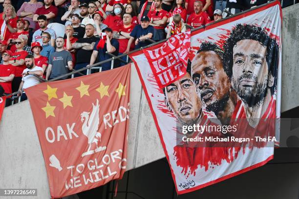 Liverpool fans display a banner with the faces of Roberto Firmino, Sadio Mane and Mohamed Salah of Liverpool during The FA Cup Final match between...