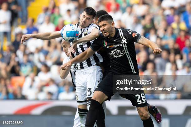 Ignacio Pussetto of Udinese Calcio competes for the ball with Martin Erlic of Spezia Calcio during the Serie A match between Udinese Calcio and...