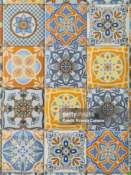 texture with floral decorated ceramic tiles - portuguese culture fotografías e imágenes de stock