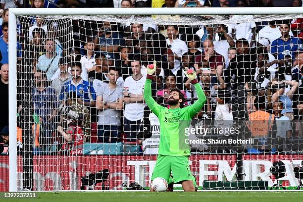 Alisson Becker of Liverpool celebrates after saving the seventh penalty from Mason Mount of Chelsea during The FA Cup Final match between Chelsea and...