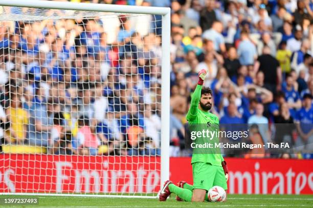 Alisson Becker of Liverpool celebrates saving the Chelsea seventh penalty taken by Mason Mount in the penalty shoot out during The FA Cup Final match...