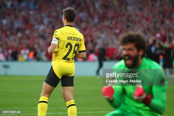 Cesar Azpilicueta of Chelsea looks dejected after missing a penalty, as Alisson of Liverpool celebrates during The FA Cup Final match between Chelsea...