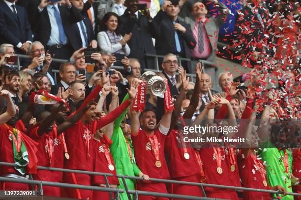 Jordan Henderson of Liverpool lifts The FA Cup trophy after their sides victory during The FA Cup Final match between Chelsea and Liverpool at...
