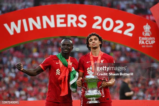 Sadio Mane and Trent Alexander-Arnold of Liverpool celebrate with The Emirates FA Cup trophy after their sides victory during The FA Cup Final match...