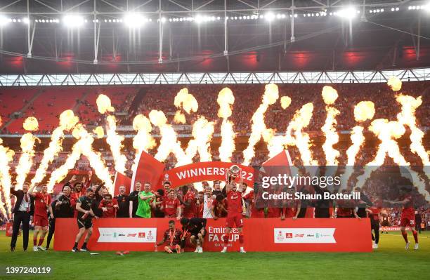 Jordan Henderson of Liverpool lifts The Emirates FA Cup trophy after their sides victory during The FA Cup Final match between Chelsea and Liverpool...