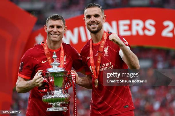 James Milner and Jordan Henderson of Liverpool celebrate with The Emirates FA Cup trophy after their sides victory during The FA Cup Final match...