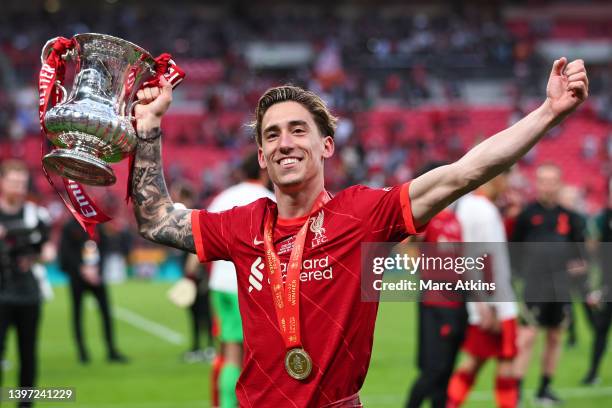 Konstantinos Tsimikas of Liverpool celebrates with the Emirates FA Cup trophy following his team's victory in The FA Cup Final match between Chelsea...