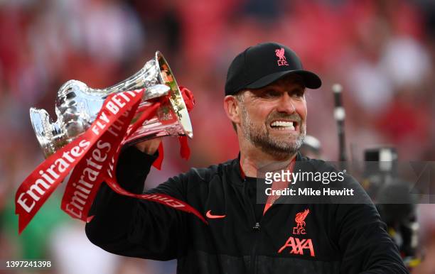 Juergen Klopp, Manager of Liverpool celebrates with The Emirates FA Cup trophy after their sides victory during The FA Cup Final match between...