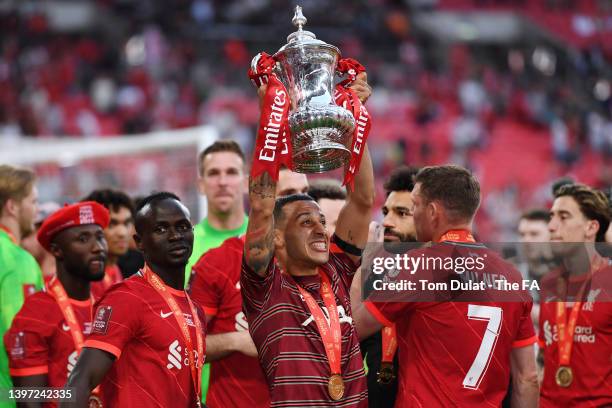 Thiago Alcantara of Liverpool celebrates with The Emirates FA Cup trophy following victory in The FA Cup Final match between Chelsea and Liverpool at...