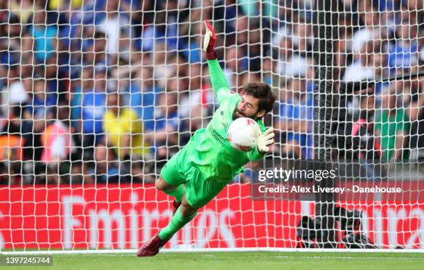 Alisson Becker of Liverpool makes a save from Mason Mount of Chelsea during a penalty shoot out in The FA Cup Final match between Chelsea and...