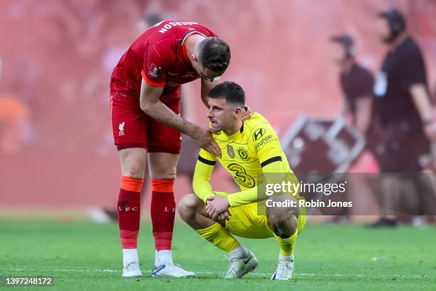 Mason Mount of Chelsea whose penalty miss ultimately led to Liverpool's 6-5 shootout win after a 0-0 draw is comforted by Jordan Henderson of...