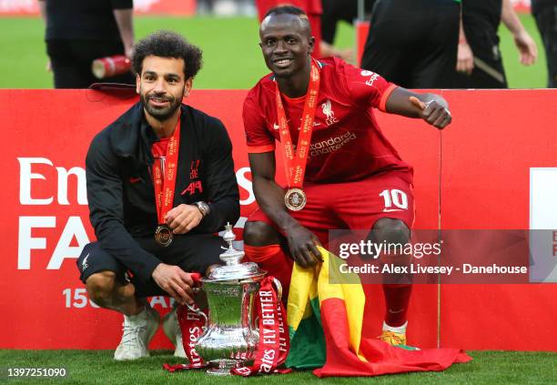 Mohamed Salah and Sadio Mane of Liverpool celebrate after The FA Cup Final match between Chelsea and Liverpool at Wembley Stadium on May 14, 2022 in...