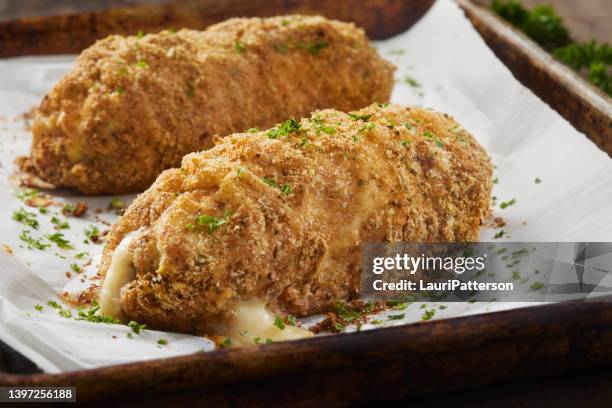 crispy baked chicken cordon bleu - cordon bleu stock pictures, royalty-free photos & images