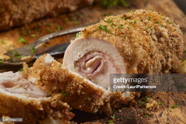 crispy baked chicken cordon bleu - cordon bleu stock pictures, royalty-free photos & images