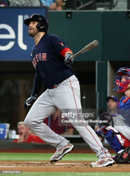 Martinez of the Boston Red Sox watches the ball go for a solo home run against the Texas Rangers in the first inning at Globe Life Field on May 14,...