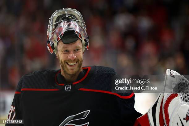 Antti Raanta of the Carolina Hurricanes celebrates their 3-2 victory over the Boston Bruins in Game Seven of the First Round of the 2022 Stanley Cup...