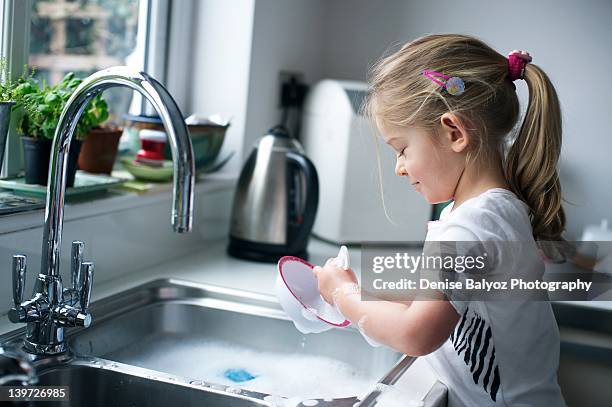 girl washing dish - dirty dishes ストックフォトと画像