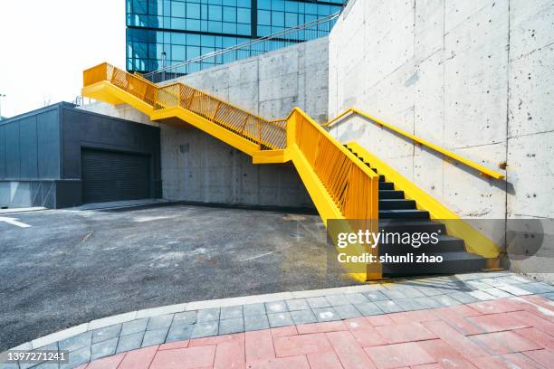 yellow stairs - wall city foto e immagini stock