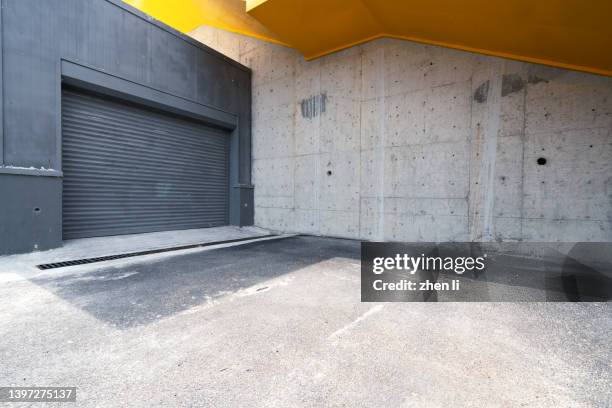 outside the garage door - industrial doors stock pictures, royalty-free photos & images