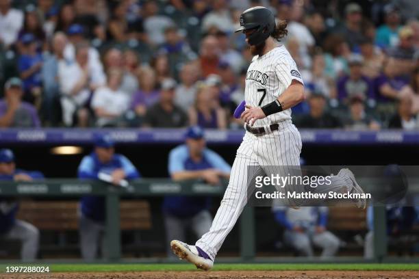 Brendan Rodgers of the Colorado Rockies scroes on a Sam Hillard RBI sacrifice fly against the Kansas City Royals in the fifth inning at Coors Field...
