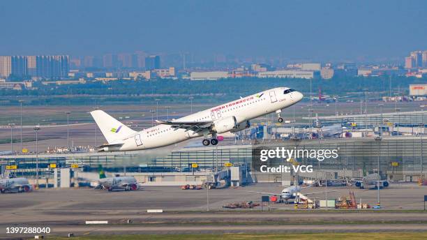 The first C919 large passenger aircraft to be delivered takes off from Shanghai Pudong International Airport on May 14, 2022 in Shanghai, China. The...