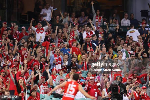 Sam Wicks of the Swans celebrates to the crowd after kicking a goal during the round nine AFL match between the Sydney Swans and the Essendon Bombers...