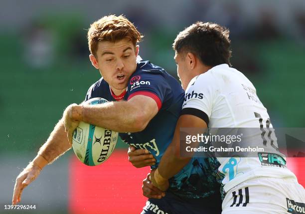 Andrew Kellaway of the Rebels is tackled during the round 13 Super Rugby Pacific match between the Melbourne Rebels and the Chiefs at AAMI Park on...