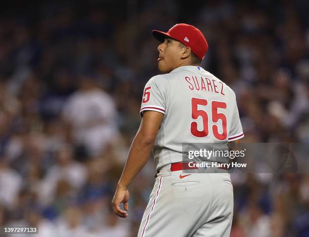 Ranger Suarez of the Philadelphia Phillies reacts to the pop fly out of Chris Taylor of the Los Angeles Dodgers to end the sixth inning at Dodger...