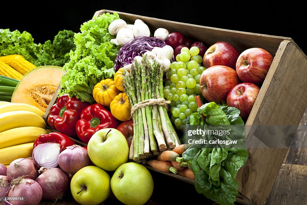 Rustic crate full of fruits and vegetables