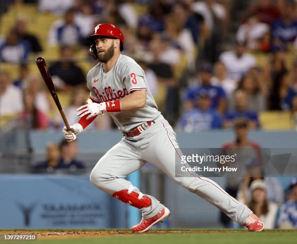 Bryce Harper of the Philadelphia Phillies reacts to his bunt down the third base line during the eighth inning against the Los Angeles Dodgers at...