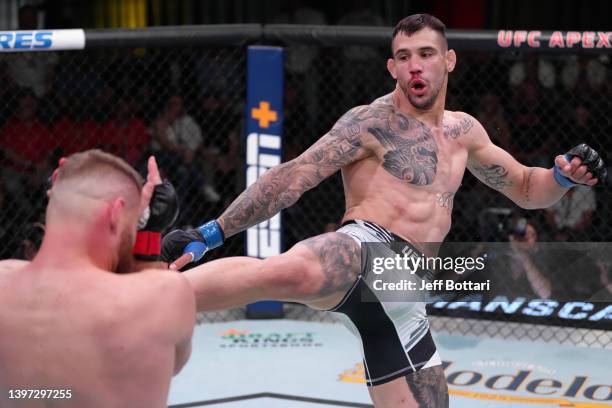 Aleksandar Rakic of Austria kicks Jan Blachowicz of Poland in a light heavyweight fight during the UFC Fight Night event at UFC APEX on May 14, 2022...