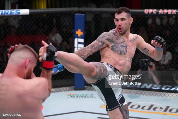 Aleksandar Rakic of Austria kicks Jan Blachowicz of Poland in a light heavyweight fight during the UFC Fight Night event at UFC APEX on May 14, 2022...