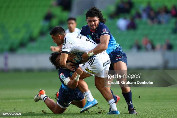 Quinn Tupaea of the Chiefs is tackled during the round 13 Super Rugby Pacific match between the Melbourne Rebels and the Chiefs at AAMI Park on May...