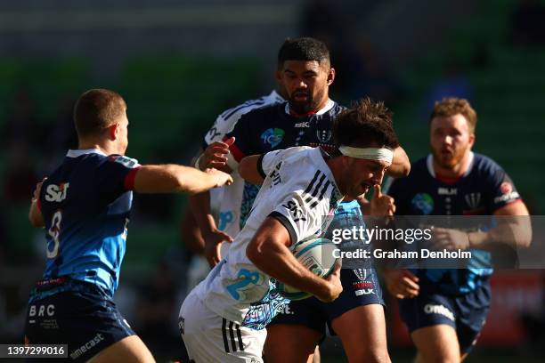 Josh Lord of the Chiefs is tackled during the round 13 Super Rugby Pacific match between the Melbourne Rebels and the Chiefs at AAMI Park on May 15,...